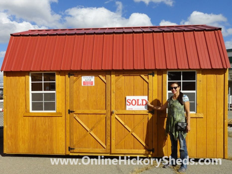 A woman happy with her new Hickory Shed