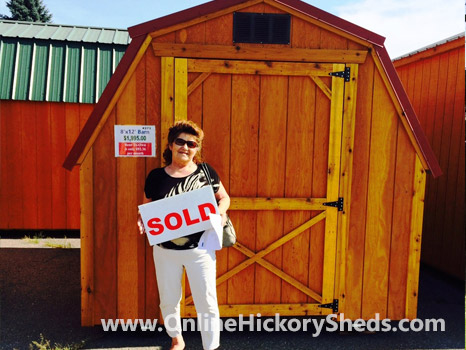 A woman happy with her new Hickory Shed